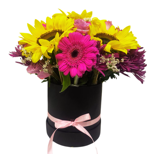 Caja Redonda de Girasoles Gerberas y Rosas en Tono Morado